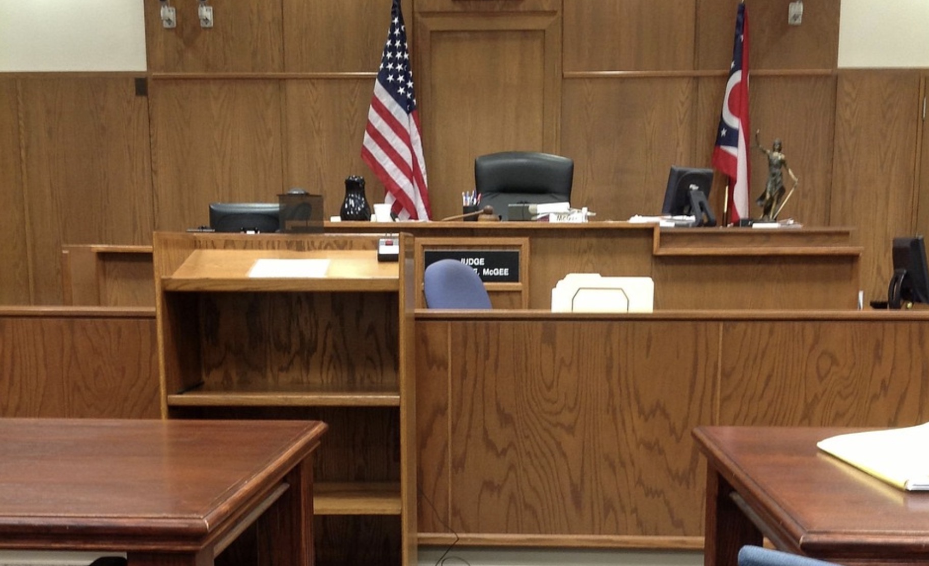 Image of a courtroom. You are looking at the judge's seat.