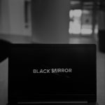laptop watching black mirror